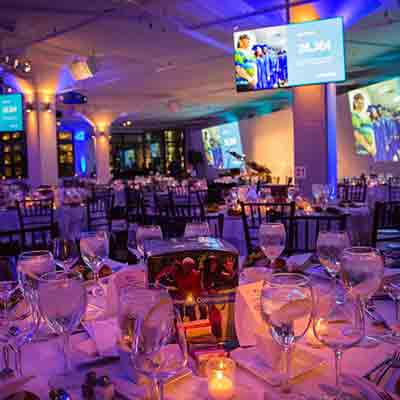 photo: seated dinner set up with multimedia presentation at tr360