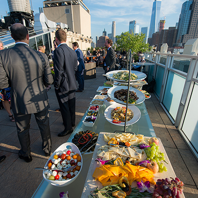 photo: mediterranian appetizer table on rooftop at corporate event